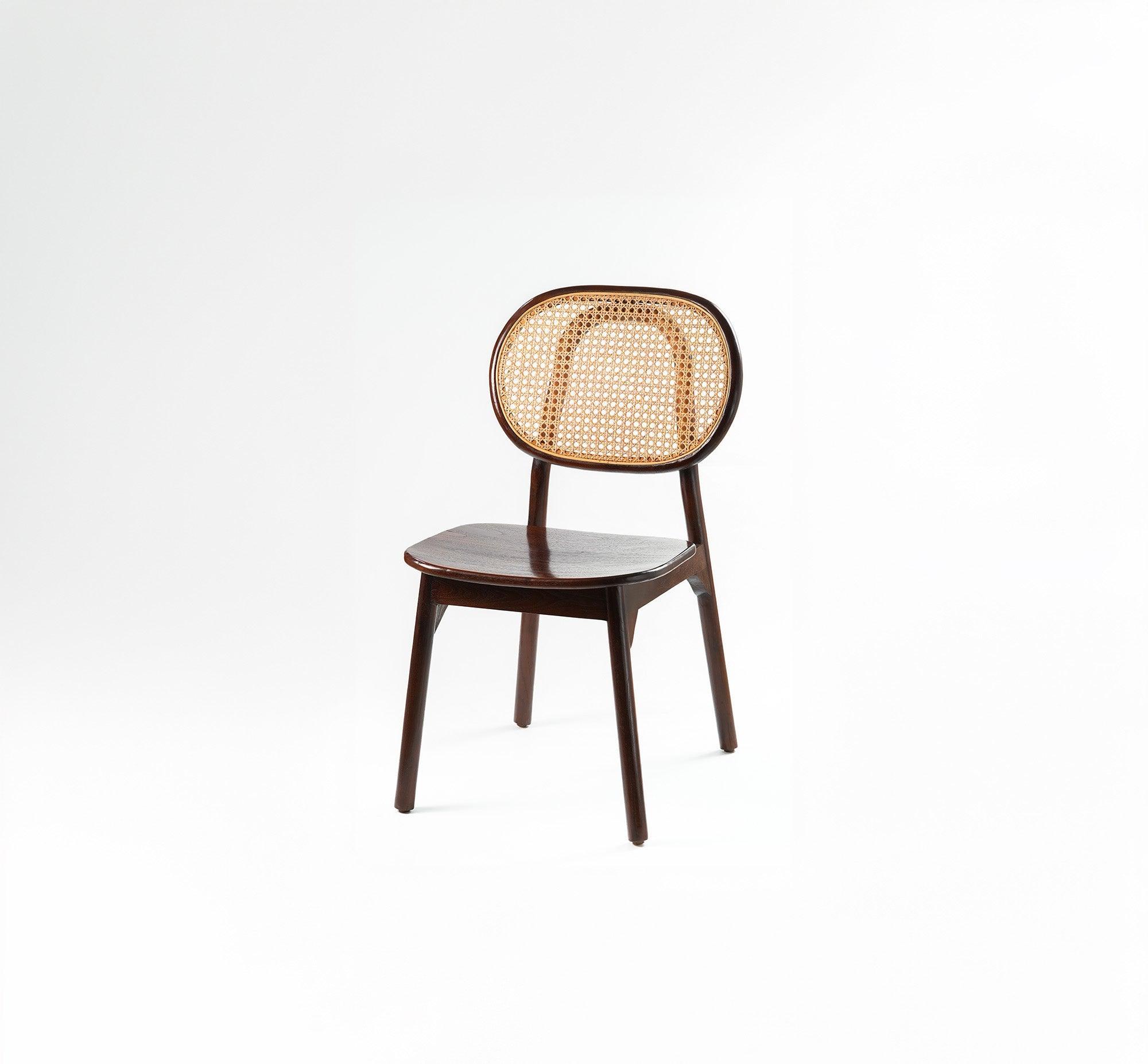 A close-up of the Zen Dining Chair, showcasing its intricate details and beauty of rattan with teakwood.