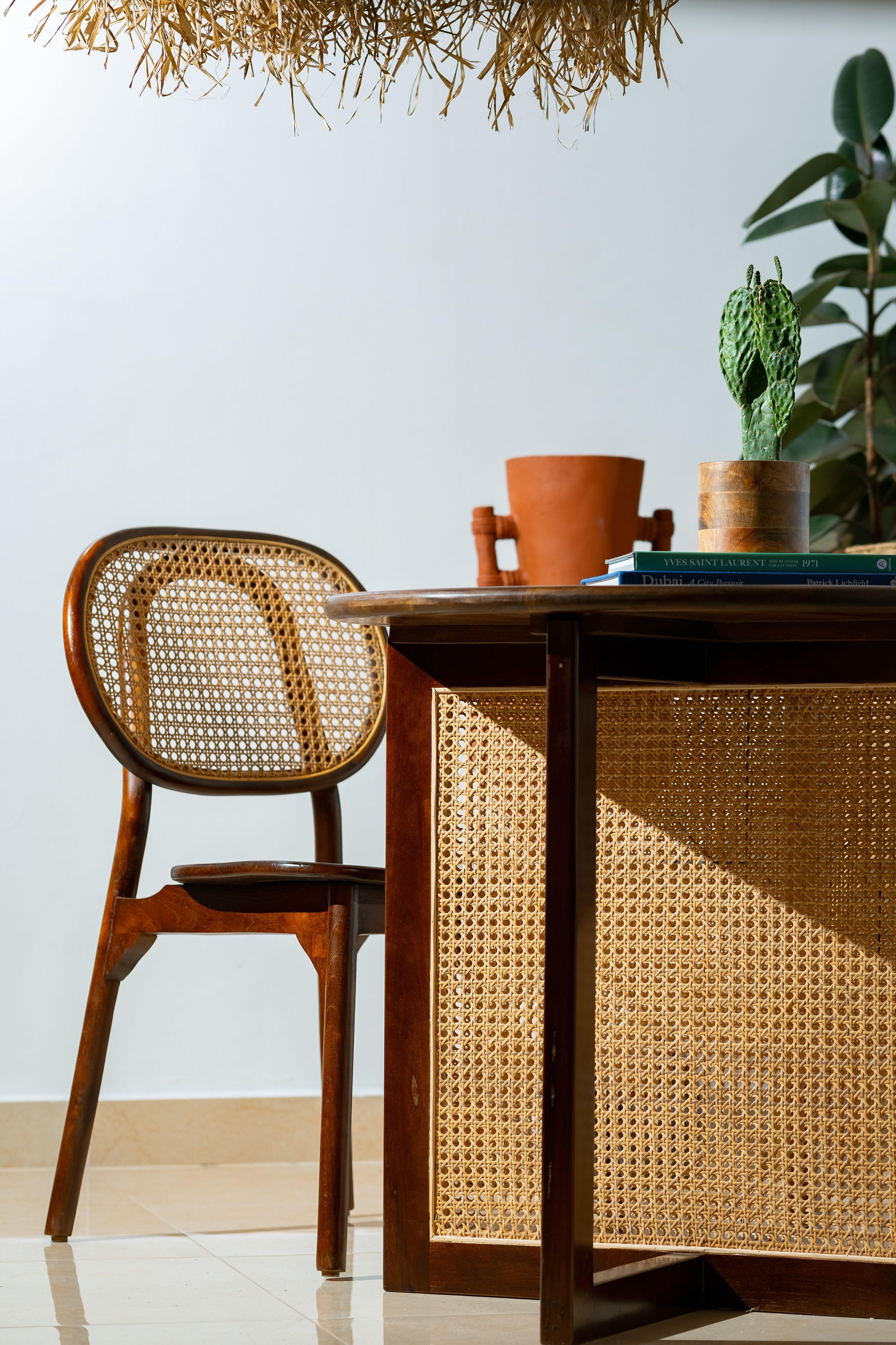 A sleek and modern dining chair with curved corners, perfect for adding a touch of elegance to your dining room.